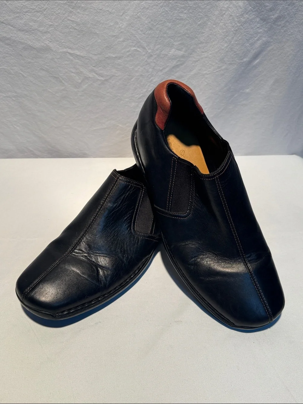 Cole Haan Black Leather Slip-On Loafers with Brown Heel Tab